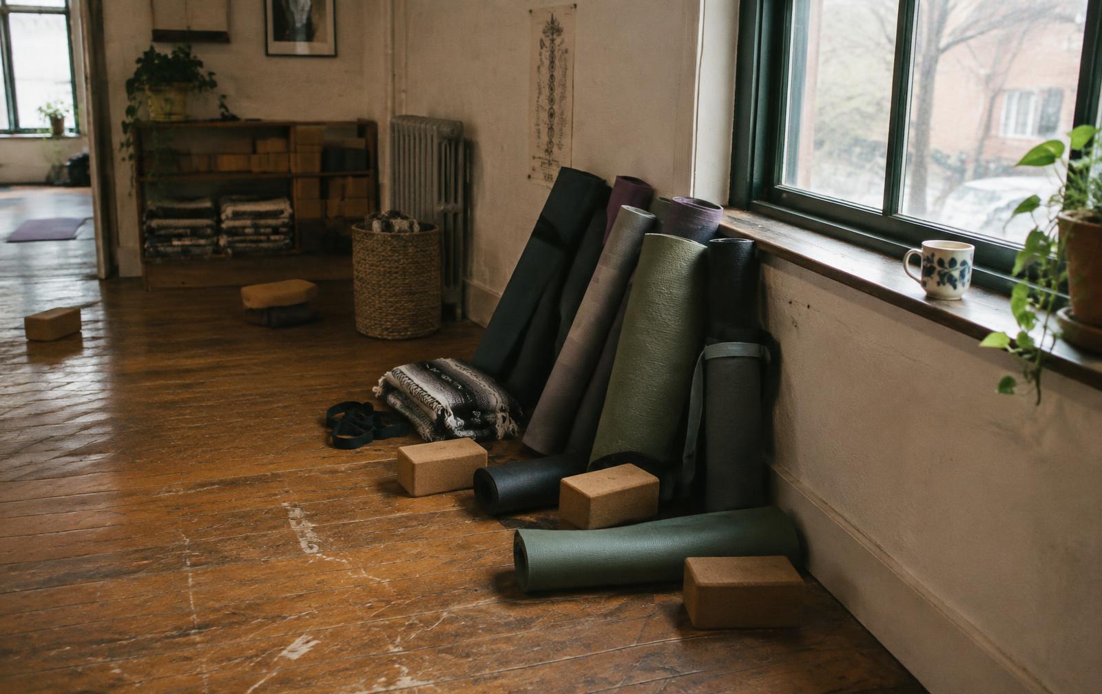 Warm and peaceful yoga studio prepared for a class